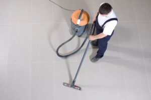 man cleaning up construction site